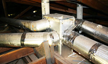 Asbestos air ducts serving the air conditioning system are poorly insulated